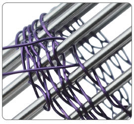 Wire being wrapped around jig pegs